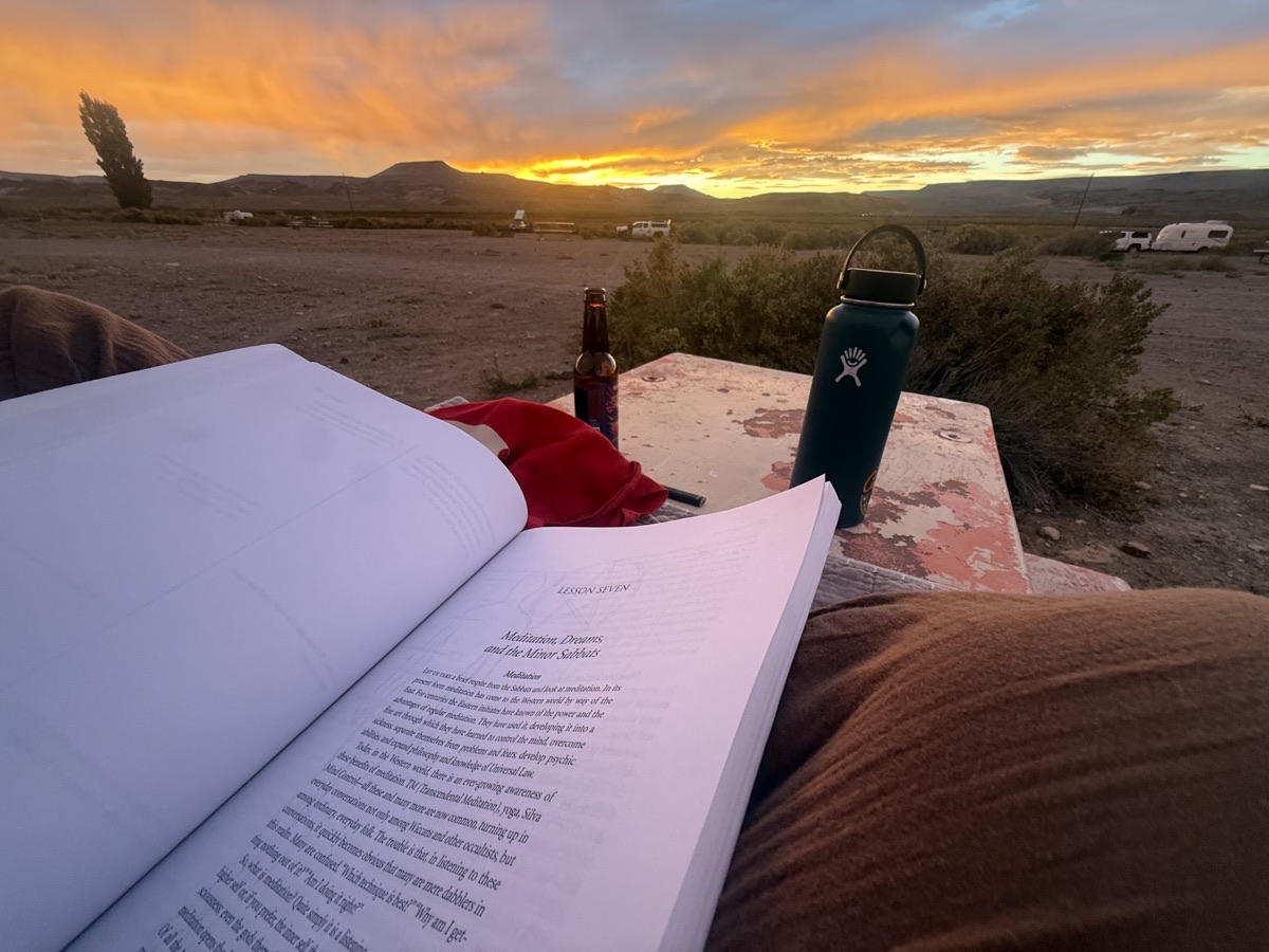 Open book and Hydro Flask at sunset in Virgin Valley